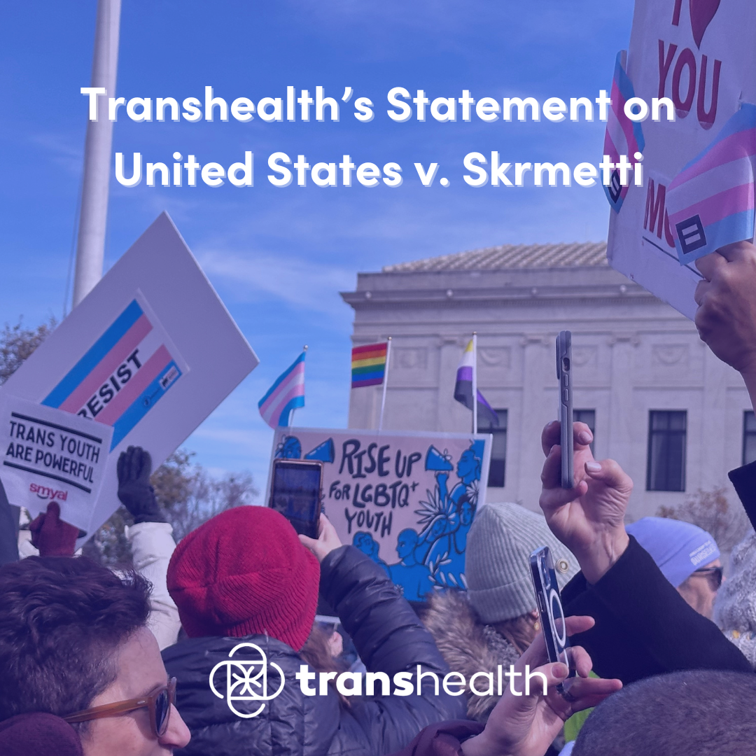 People holding trans rights signs and flags in front of the US. Supreme Court